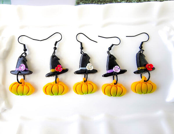 Orellie's handmade witch hat and pumpkin earrings, New Zealand-made and available in different colors. Choose your favorite spooky design for the perfect Halloween accessory.