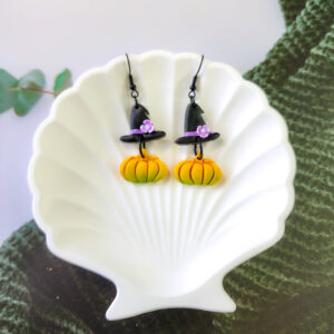 Orellie's handmade witch hat and pumpkin earrings, New Zealand-made and available in different colors. Choose your favorite spooky design for the perfect Halloween accessory.