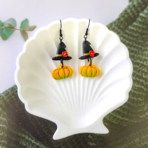 Orellie's handmade witch hat and pumpkin earrings, New Zealand-made and available in different colors. Choose your favorite spooky design for the perfect Halloween accessory.