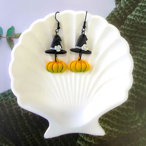 Orellie's handmade witch hat and pumpkin earrings, New Zealand-made and available in different colors. Choose your favorite spooky design for the perfect Halloween accessory.