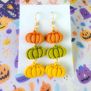 Orellie's handmade triple pumpkin earrings, designed and crafted in New Zealand. These colorful and festive earrings are the perfect addition to your Halloween wardrobe.