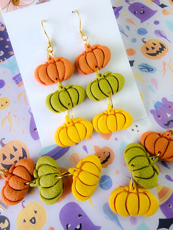 Orellie's handmade triple pumpkin earrings, designed and crafted in New Zealand. These colorful and festive earrings are the perfect addition to your Halloween wardrobe.