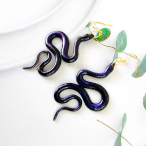 Orellie's handmade glitter snake earrings, New Zealand-made with five stunning variations. Add a bold and sparkling touch to your style with these unique accessories.