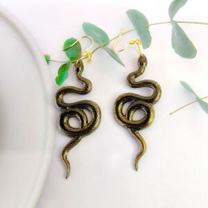 Orellie's handmade shimmer snake earrings, New Zealand-made with five variations. Add a dazzling and bold touch to your outfit with these unique accessories.