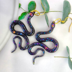 Orellie's handmade glitter snake earrings, New Zealand-made with five stunning variations. Add a bold and sparkling touch to your style with these unique accessories.