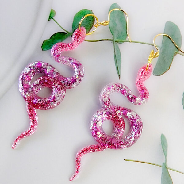 Orellie's handmade shimmer snake earrings, New Zealand-made with five variations. Add a dazzling and bold touch to your outfit with these unique accessories.