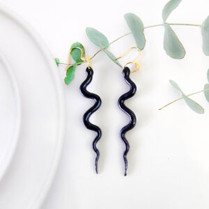 Orellie's handmade sparkle snake earrings, New Zealand-made with two stunning variations. Add an elegant and bold touch to your outfit with these dazzling earrings.