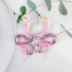 Orellie's handmade glitter snake earrings, New Zealand-made with five stunning variations. Add a bold and sparkling touch to your style with these unique accessories.