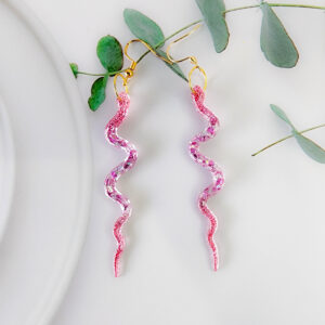 Orellie's handmade sparkle snake earrings, New Zealand-made with two stunning variations. Add an elegant and bold touch to your outfit with these dazzling earrings.