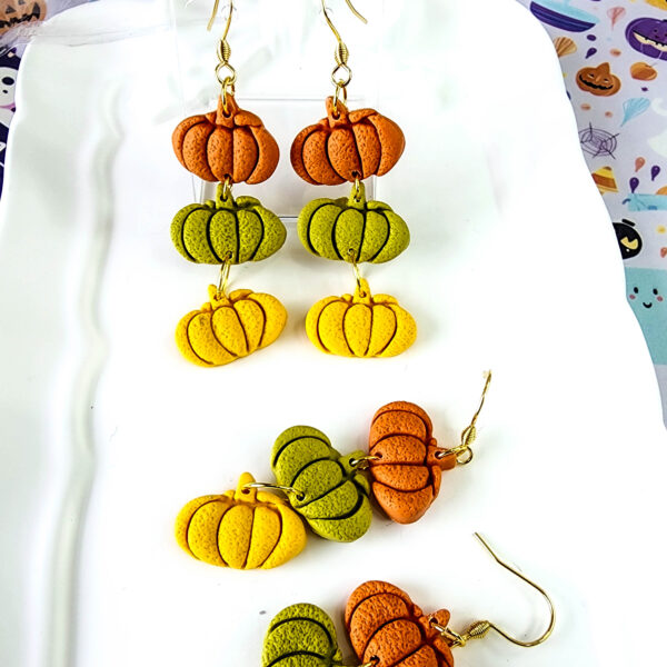 Orellie's handmade triple pumpkin earrings, designed and crafted in New Zealand. These colorful and festive earrings are the perfect addition to your Halloween wardrobe.