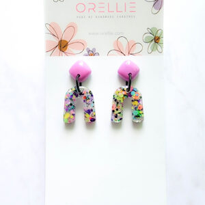 Brighten up your day with Orellie's handmade confetti arch earrings, designed and made in New Zealand. A perfect pop of color for any outfit.