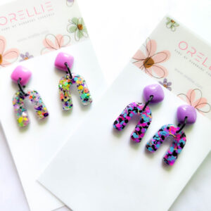 Brighten up your day with Orellie's handmade confetti arch earrings, designed and made in New Zealand. A perfect pop of color for any outfit.