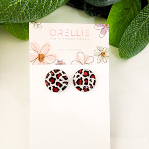 Add a touch of wild style to your look with these Leopard Print stud earrings. Handcrafted by Orellie, featuring a bold leopard pattern in red and black.