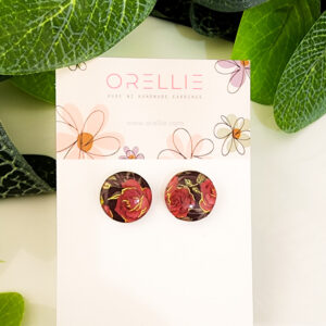 Enhance your elegance with these Rose Garden stud earrings. Handcrafted by Orellie, showcasing a beautiful rose pattern with a touch of gold foil accents.