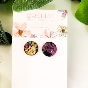 Stand out with these elegant Midnight Blossom stud earrings. Handcrafted by Orellie, featuring bold colors and a touch of gold foil for a stunning finish.