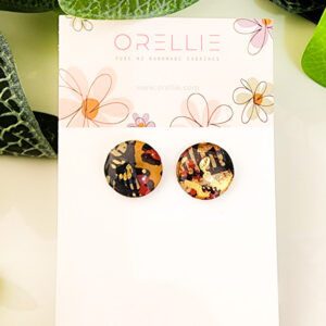 Add a bold touch to your style with these Earthy Luxe Camo stud earrings. Handcrafted by Orellie, featuring earthy tones and gold foil accents.