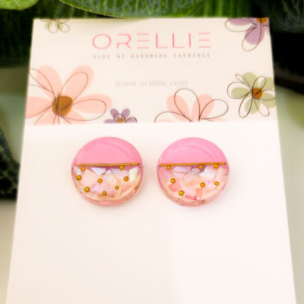 Discover our collection of Resin Circle stud earrings, available in various vibrant colors. Handcrafted by Orellie in New Zealand, these earrings are perfect for adding a touch of elegance and fun to your look.