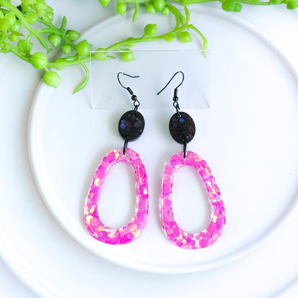 Add a touch of glam with the Pink Fizz Sparkles collection from Orellie. These statement earrings bring a pop of pink and sparkle to any look, perfect for festive events or adding a dash of fun to daily style.