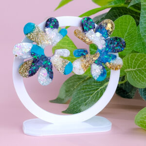 Embrace whimsical charm with the Fairy Glow Flowers collection from Orellie. These unique floral-inspired earrings add a playful sparkle to any look, perfect for fun occasions or a bold daily style.