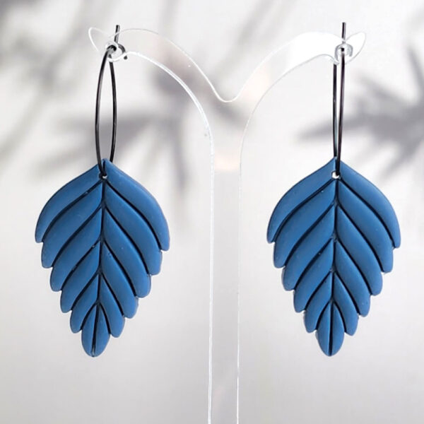 levate your style with these handmade Blue Leaf Dangle Earrings by Orellie. Perfect for adding a natural touch to any outfit, these unique earrings feature a stunning leaf design, handcrafted in New Zealand.