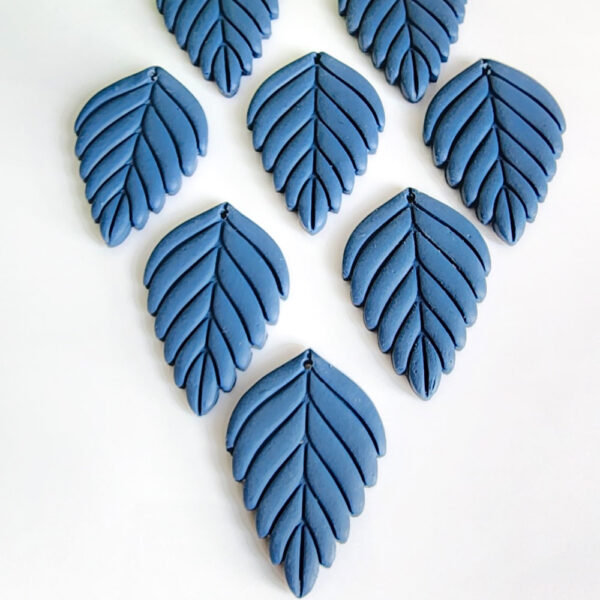 levate your style with these handmade Blue Leaf Dangle Earrings by Orellie. Perfect for adding a natural touch to any outfit, these unique earrings feature a stunning leaf design, handcrafted in New Zealand.