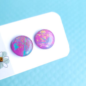 Make a statement with the hand-painted Pixie Pop Geometric Stud earrings. With their unique shape and vibrant colors, these earrings are a stylish addition to any accessory collection.