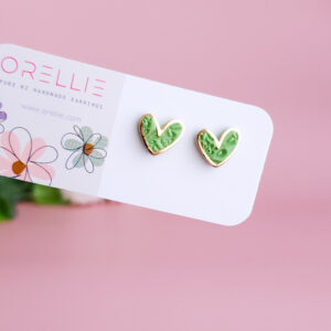 Add a touch of charm with the Heartbeat Collection from Orellie. These handcrafted heart-shaped earrings, available in vibrant colors, are the perfect accessory to showcase your unique style.