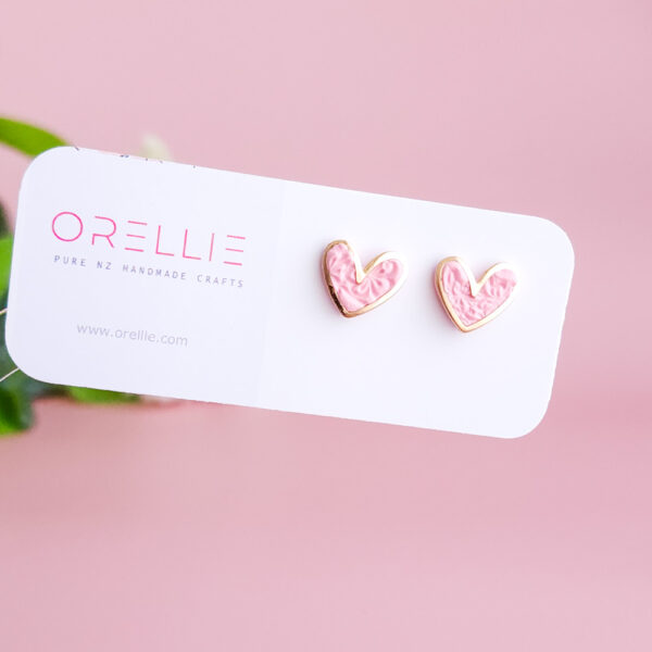 Add a touch of charm with the Heartbeat Collection from Orellie. These handcrafted heart-shaped earrings, available in vibrant colors, are the perfect accessory to showcase your unique style.