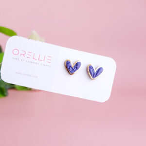 Add a touch of charm with the Heartbeat Collection from Orellie. These handcrafted heart-shaped earrings, available in vibrant colors, are the perfect accessory to showcase your unique style.