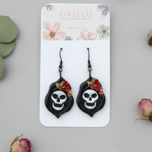 Stand out this spooky season with the “Spooky Bloom” handmade earrings from Orellie NZ. Featuring a unique skull design adorned with delicate florals, these polymer clay dangles are the perfect blend of eerie and elegant — ideal for Halloween parties, gothic styles, or alternative fashion lovers. Discover handcrafted charm with a bold twist.