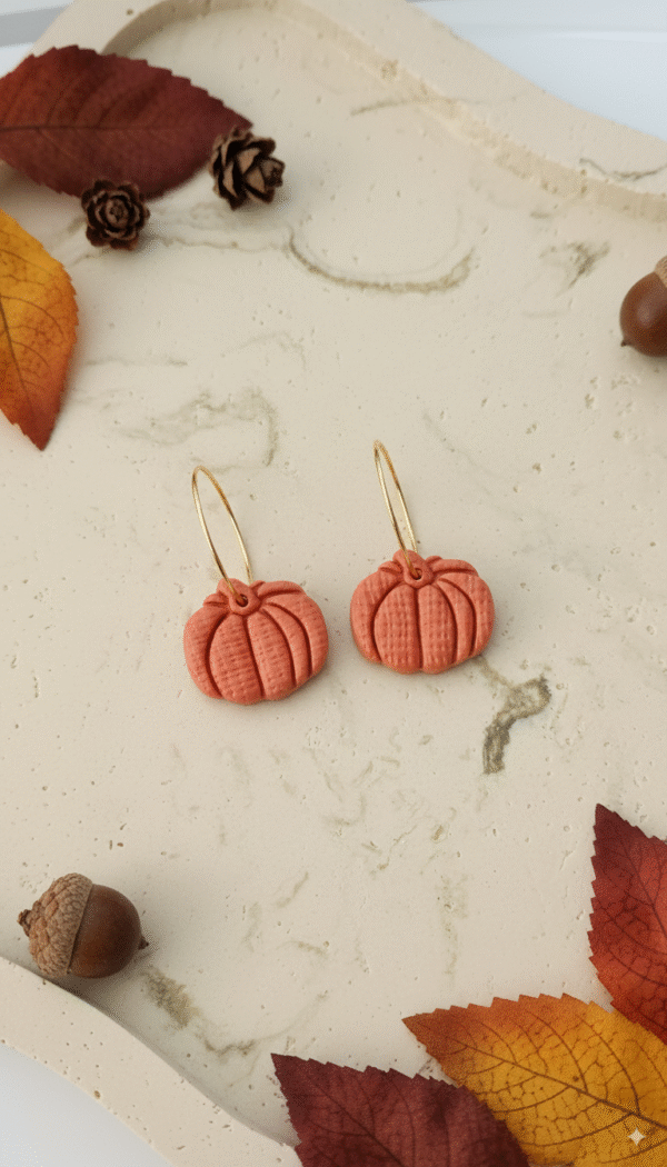 Celebrate the season with these handmade Halloween pumpkin earrings from Orellie. Lightweight, hypoallergenic, and available in vibrant fall colors – perfect for autumn vibes.