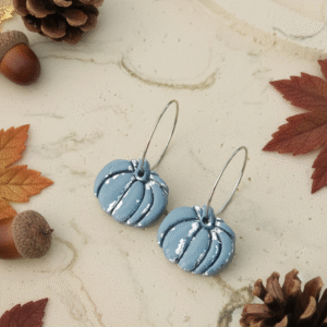 Celebrate the season with these handmade Halloween pumpkin earrings from Orellie. Lightweight, hypoallergenic, and available in vibrant fall colors – perfect for autumn vibes.