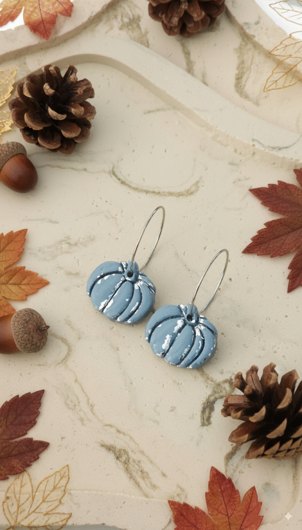 Celebrate the season with these handmade Halloween pumpkin earrings from Orellie. Lightweight, hypoallergenic, and available in vibrant fall colors – perfect for autumn vibes.