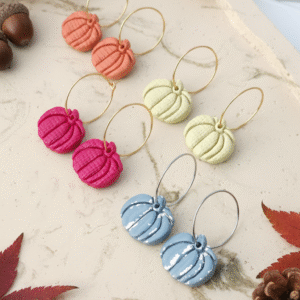 Celebrate the season with these handmade Halloween pumpkin earrings from Orellie. Lightweight, hypoallergenic, and available in vibrant fall colors – perfect for autumn vibes.