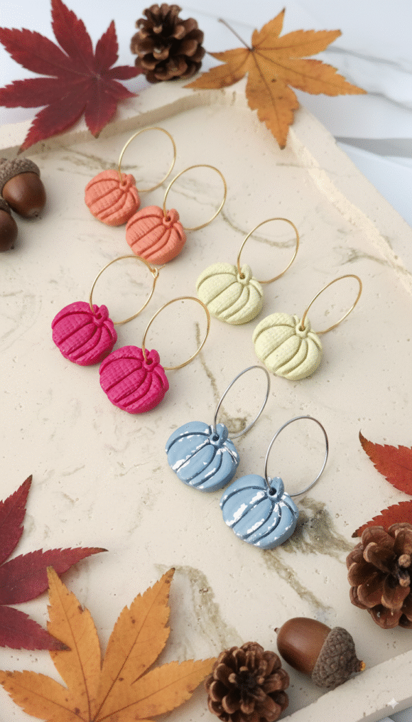 Celebrate the season with these handmade Halloween pumpkin earrings from Orellie. Lightweight, hypoallergenic, and available in vibrant fall colors – perfect for autumn vibes.