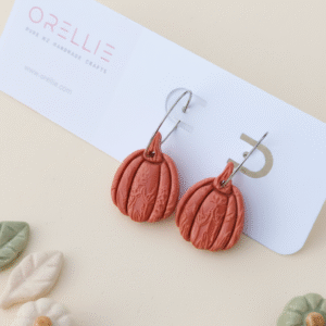 Celebrate Halloween with elegance. These handmade terracotta pumpkin earrings feature botanical embossing for a rustic, minimal, and seasonal look. Perfect for fall lovers