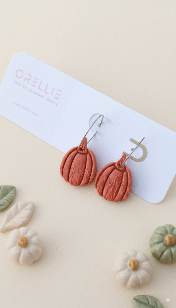 Celebrate Halloween with elegance. These handmade terracotta pumpkin earrings feature botanical embossing for a rustic, minimal, and seasonal look. Perfect for fall lovers